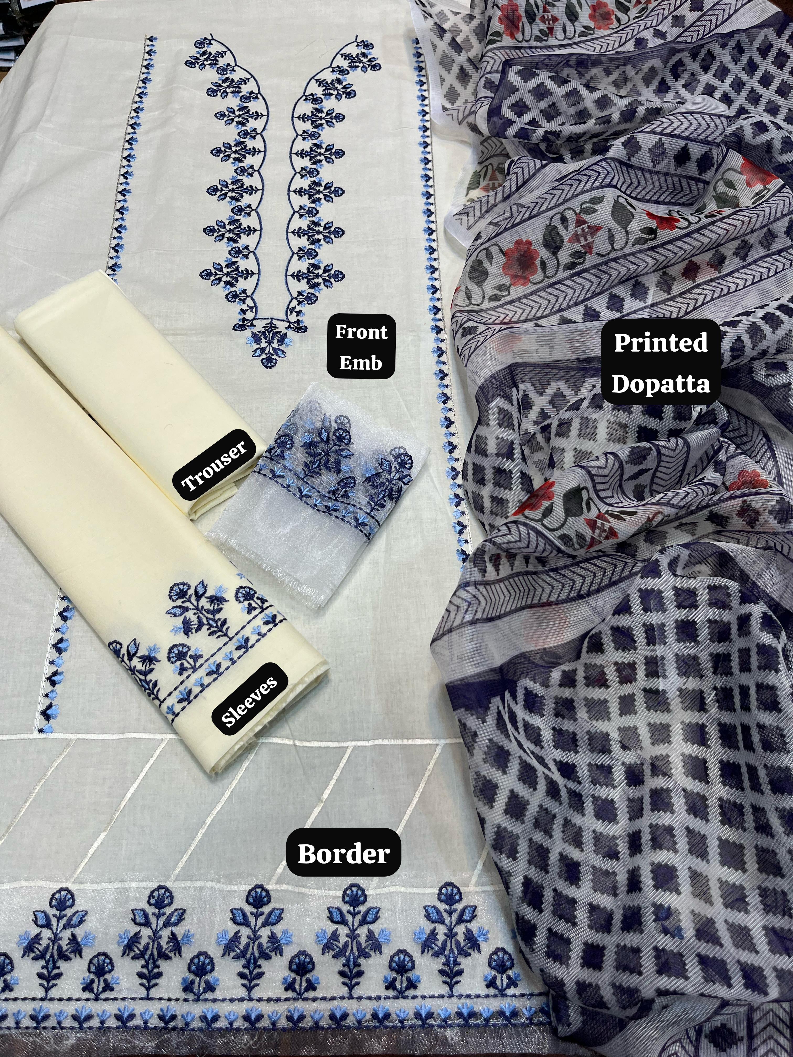 Textile items with embroidered patterns and labels on a white background