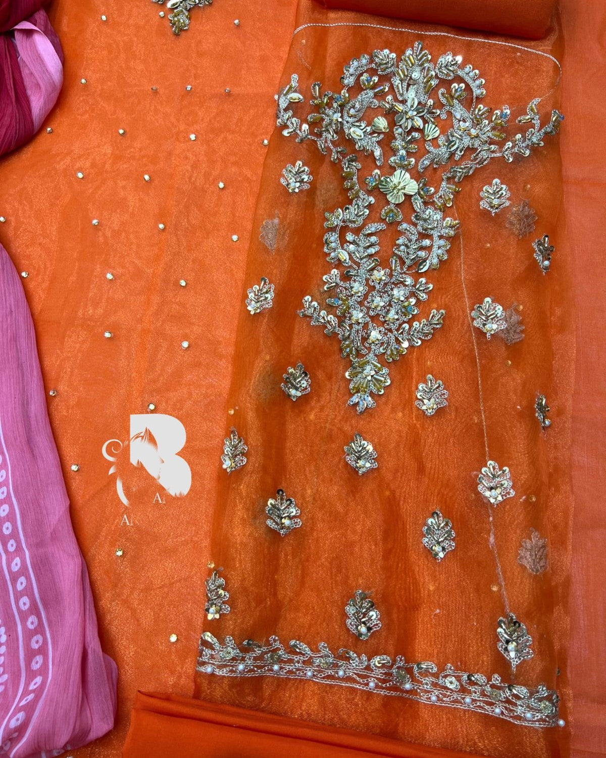 Heavy embroidered neckline with handwork on rust kalidaar dress