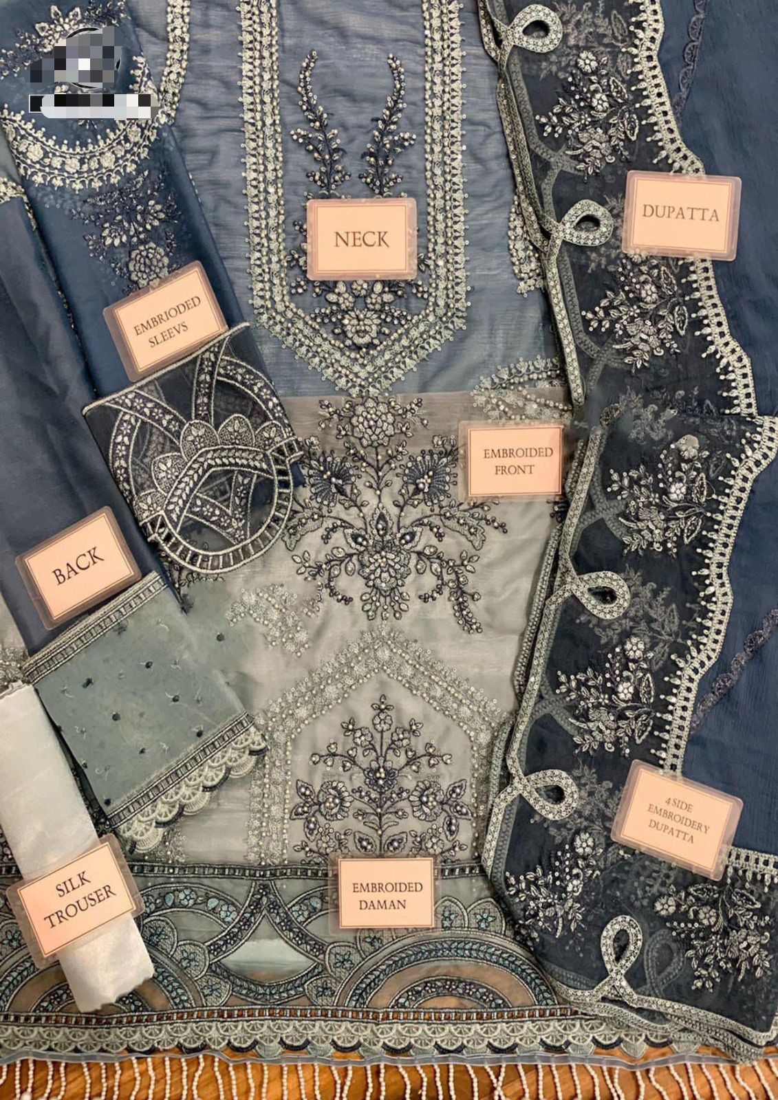 Front view of elegant chiffon embroidered dress with spangle work
Side panel with intricate embroidery and spangle detailing