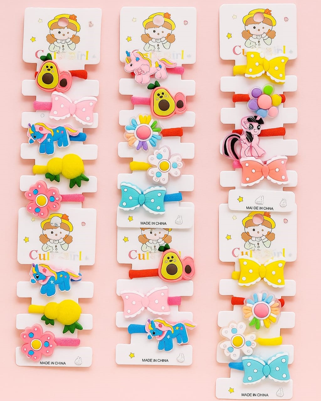 Colorful kids hair accessory cards displayed together in a 6-pack offer
Close-up of assorted hair clips and bands with bright designs