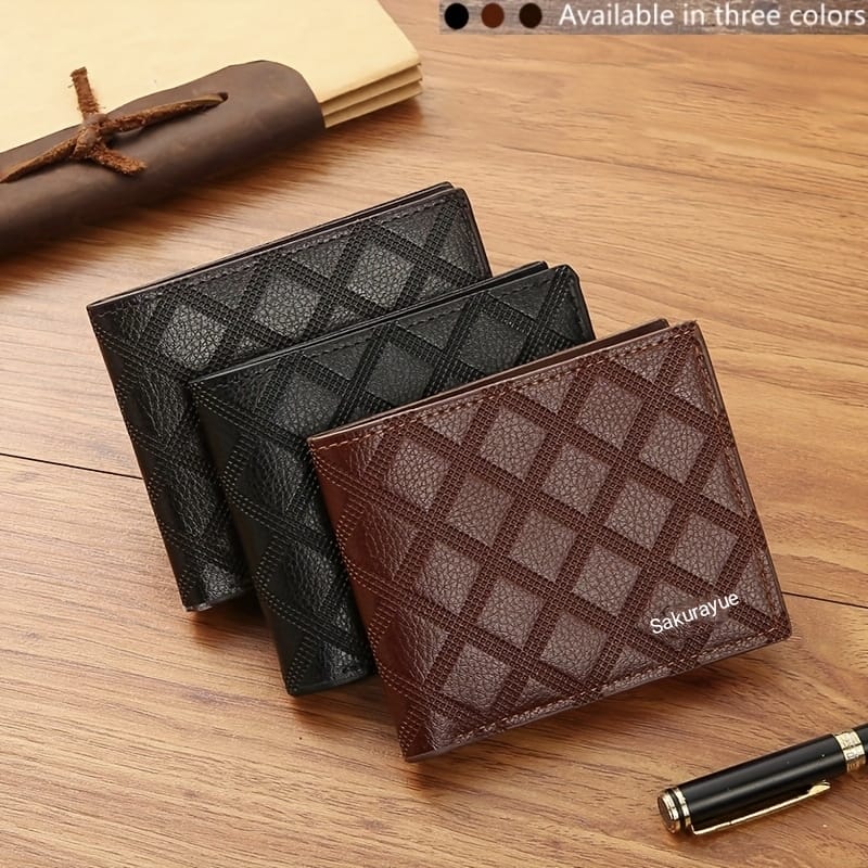 Two leather wallets, one black and one brown, with 'Sakurayue' branding on a wooden surface.