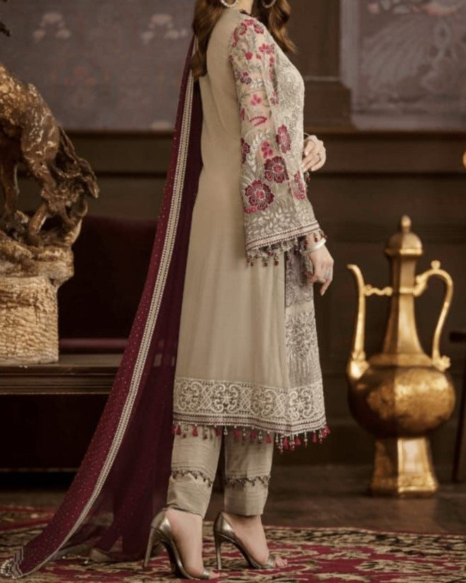 Premium chiffon embroidered 3-piece suit with heavy neckline, tassel borders, embroidered sleeves, chiffon dupatta with 4-side embroidery, and malai trouser – perfect for weddings and festive wear.