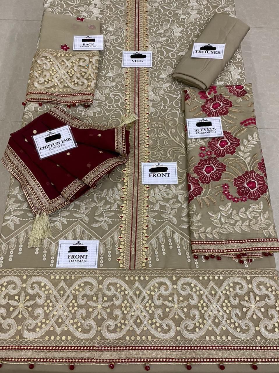 Premium chiffon embroidered 3-piece suit with heavy neckline, tassel borders, embroidered sleeves, chiffon dupatta with 4-side embroidery, and malai trouser – perfect for weddings and festive wear.