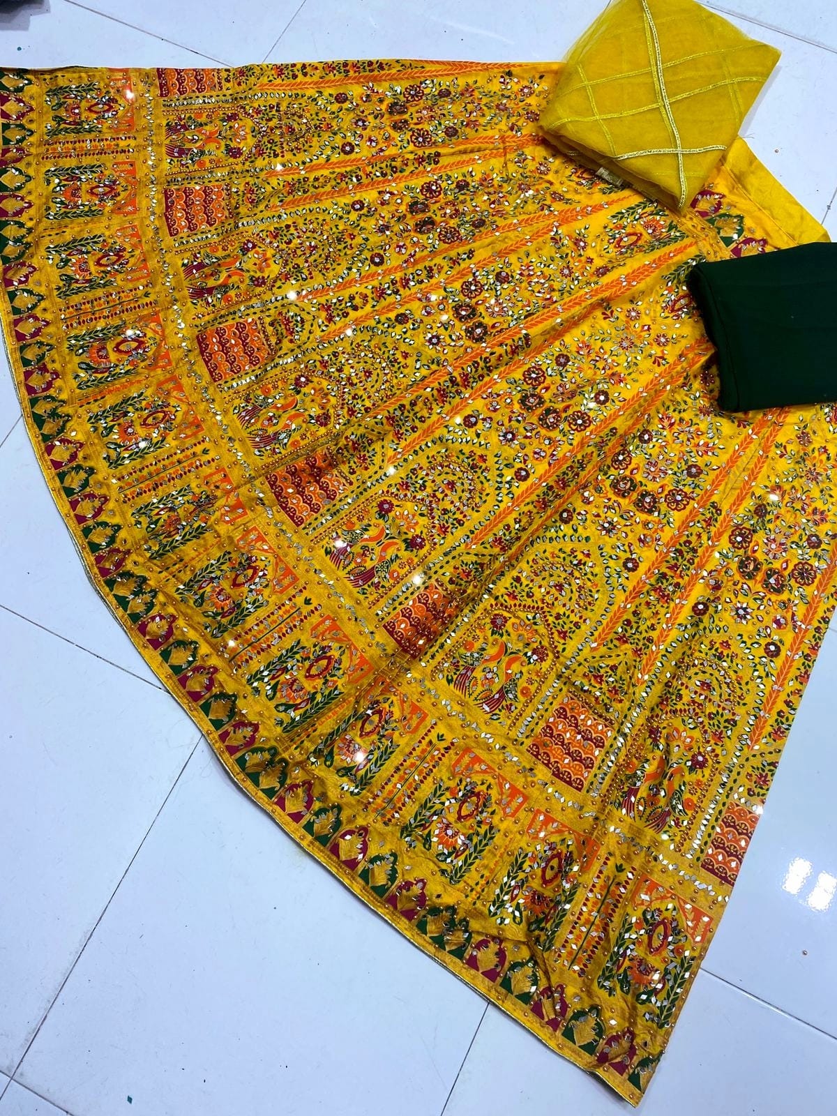 Screen print stitched lehenga with mirror stone work, unstitched katan kurti and net dupatta 3-piece set for women in Pakistan