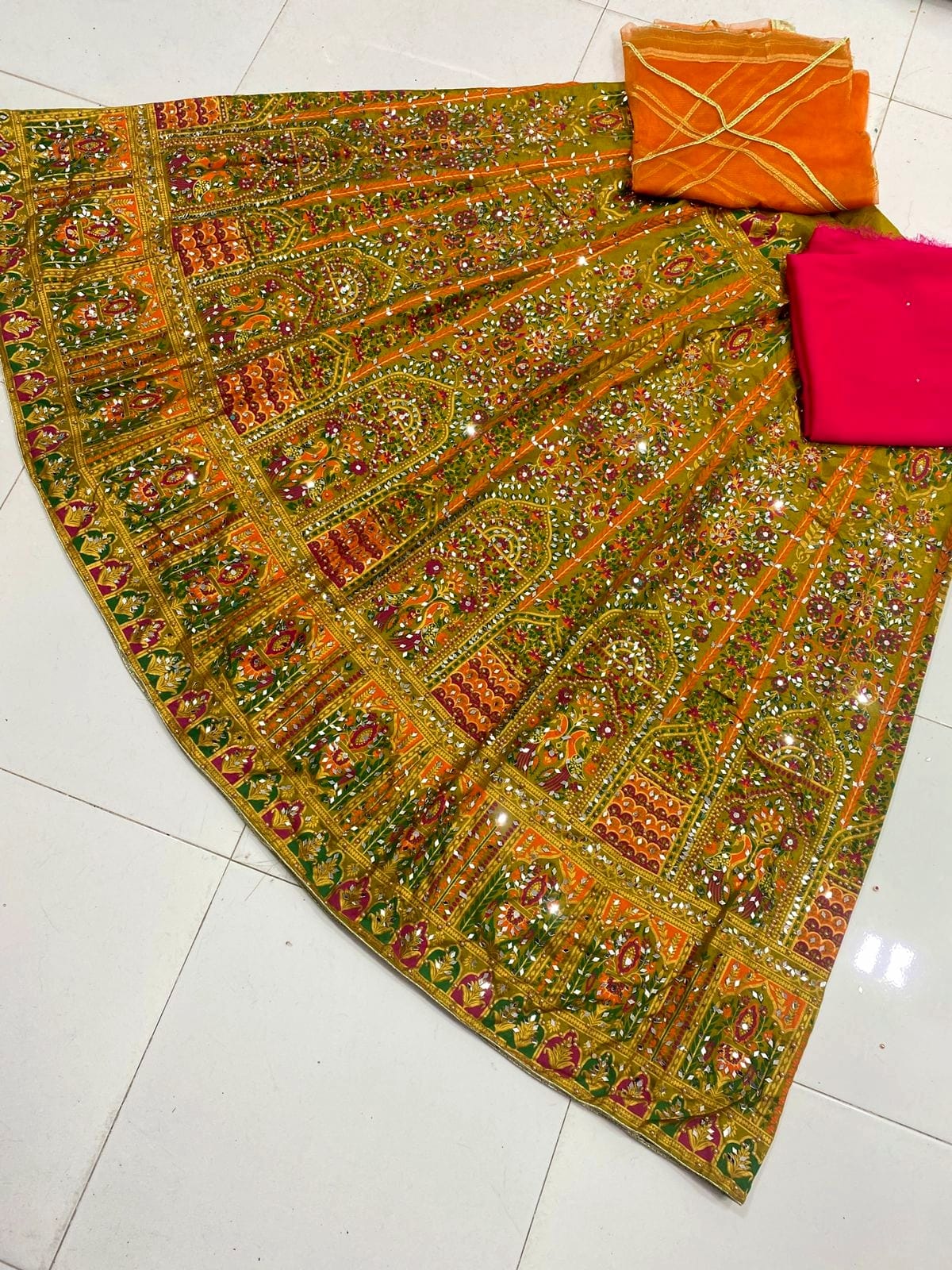 Screen print stitched lehenga with mirror stone work, unstitched katan kurti and net dupatta 3-piece set for women in Pakistan