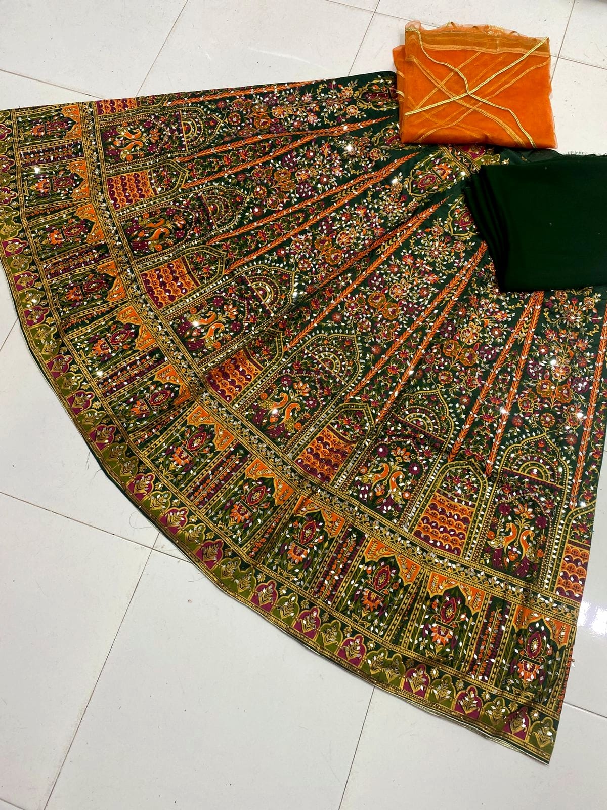 Screen print stitched lehenga with mirror stone work, unstitched katan kurti and net dupatta 3-piece set for women in Pakistan