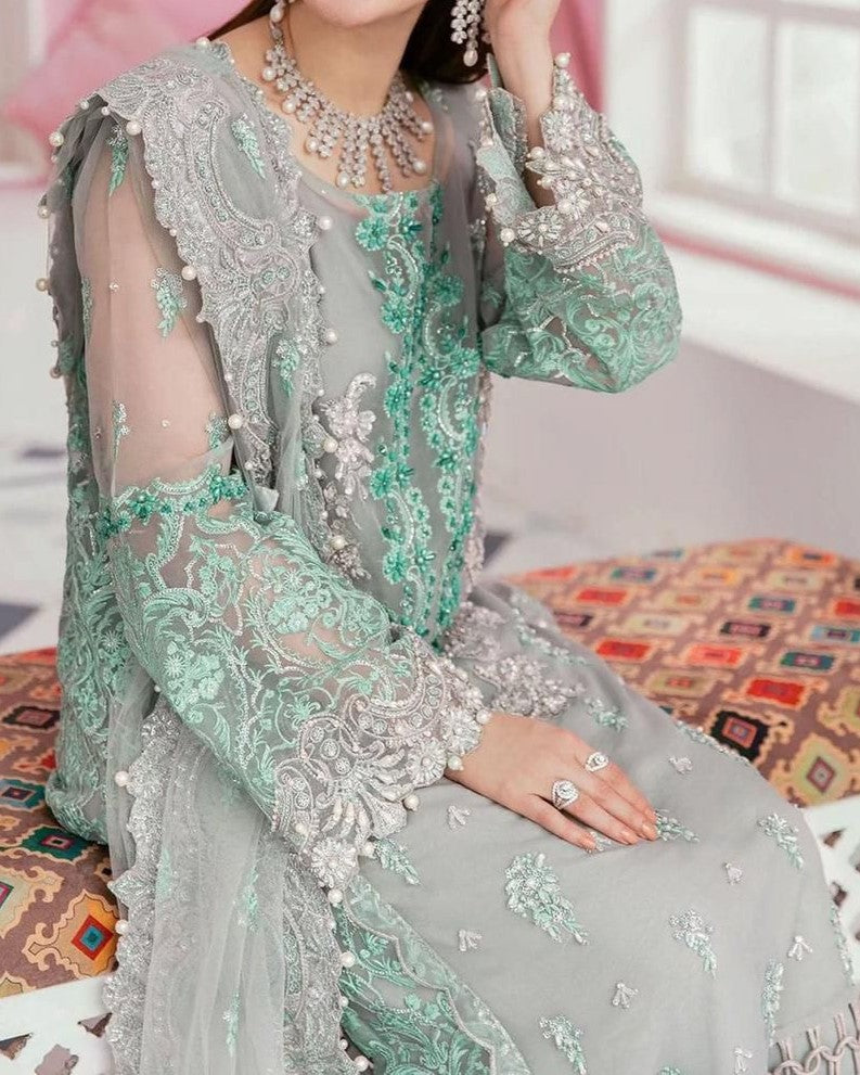 Bridal organza embroidered dress with handwork, pearl sleeves, tassel dupatta and malai trouser for women in Pakistan