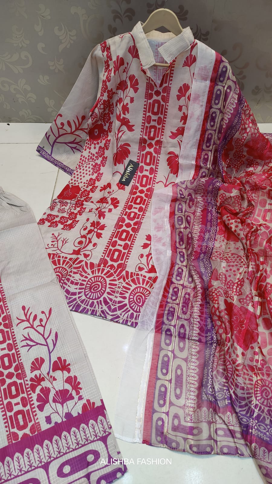 Women’s 3 piece mid-summer cotton lawn suit with digital print work, stitched shirt, trouser, and fancy dupatta – summer collection outfit in Pakistan.