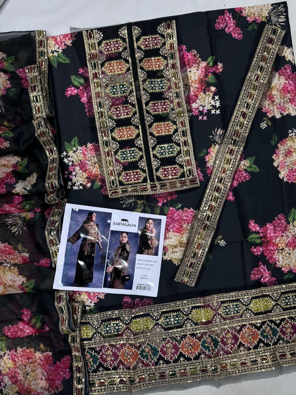 Luxury pure silk 3-piece unstitched suit with heavy embroidery and 4-side lace dupatta – digital printed women’s outfit Pakistan 2025