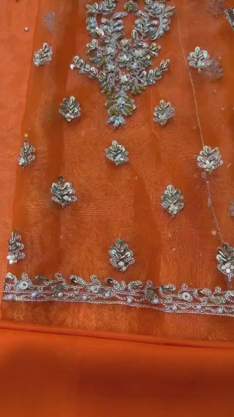 Heavy embroidered neckline with handwork on rust kalidaar dress