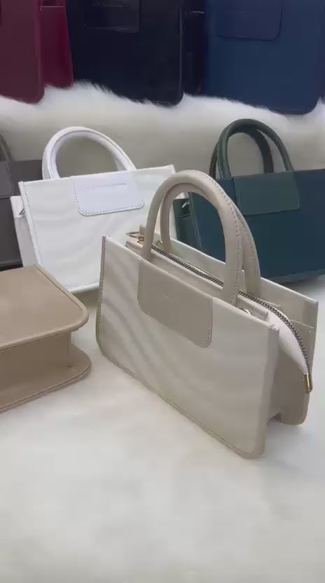 Luxury women’s shoulder bag with long strap, metal zip, and elegant compact design – buyfromdanish.com